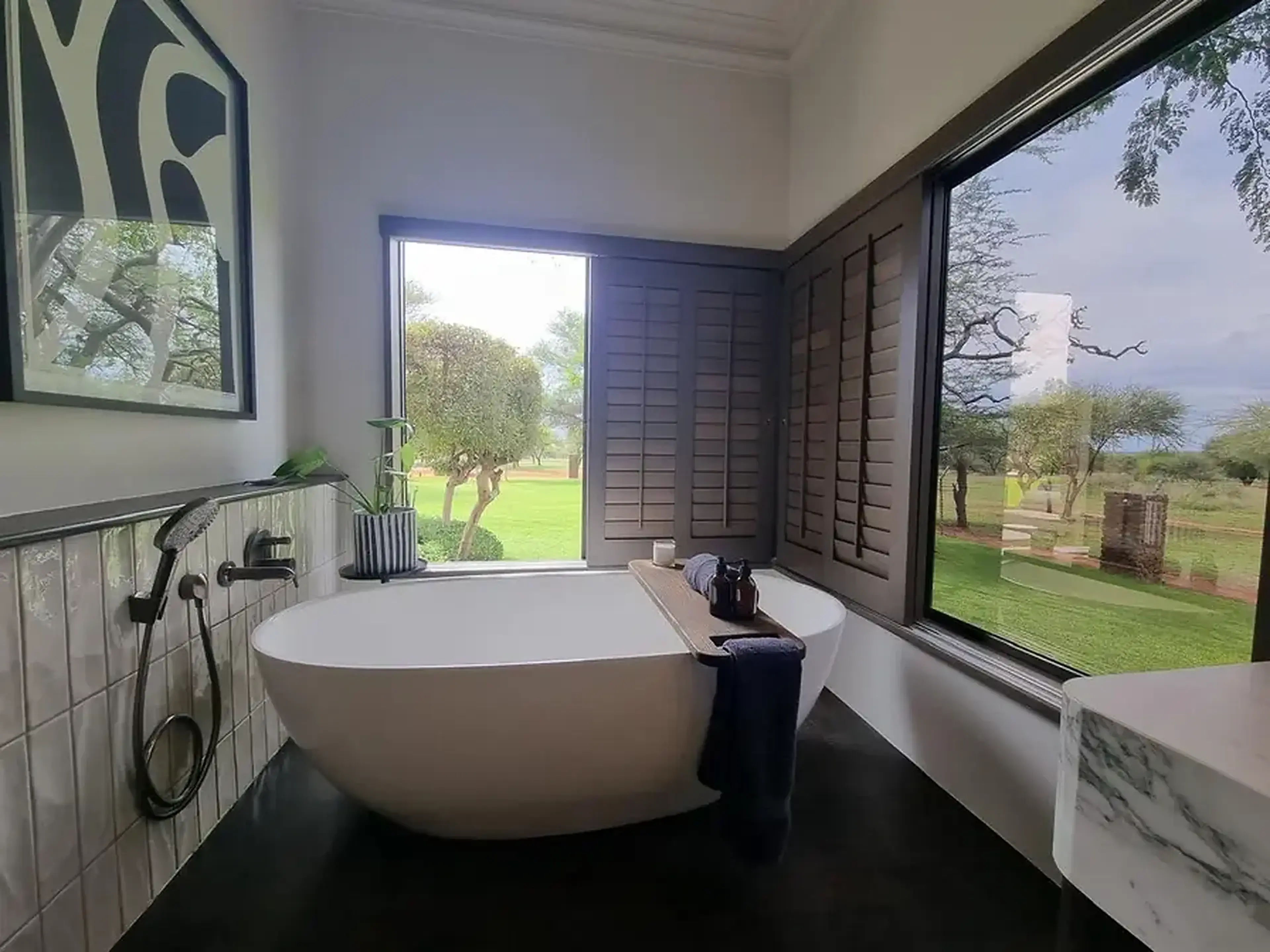 Calm contemporary bathroom overlooking a garden